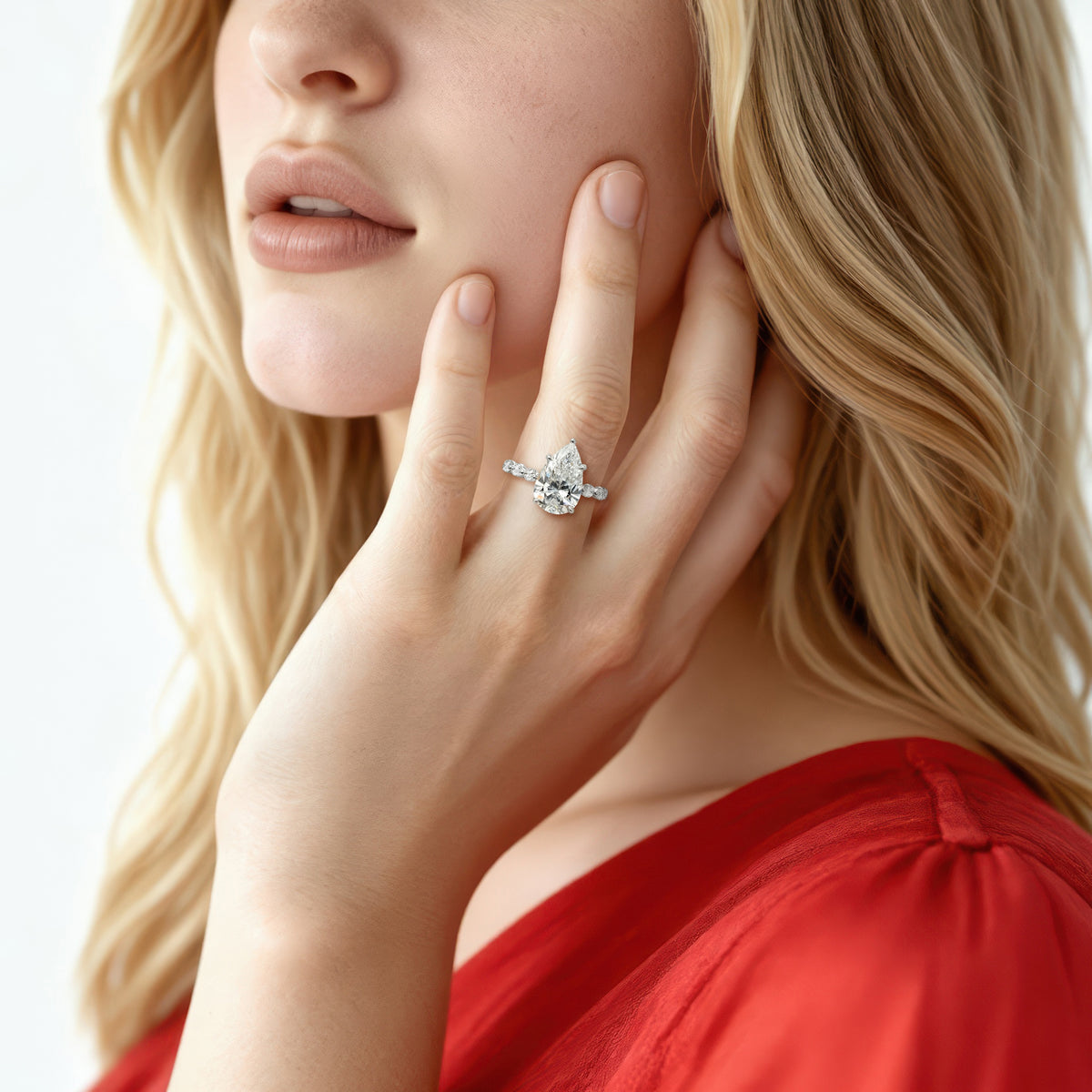 Martin Flyer Pear Diamond Shared Prong Engagement Ring — photo 2 of 3